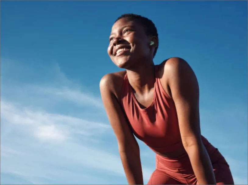 Active woman smiling and pain-free after acupuncture treatment at Health Pointe Jacksonville, FL