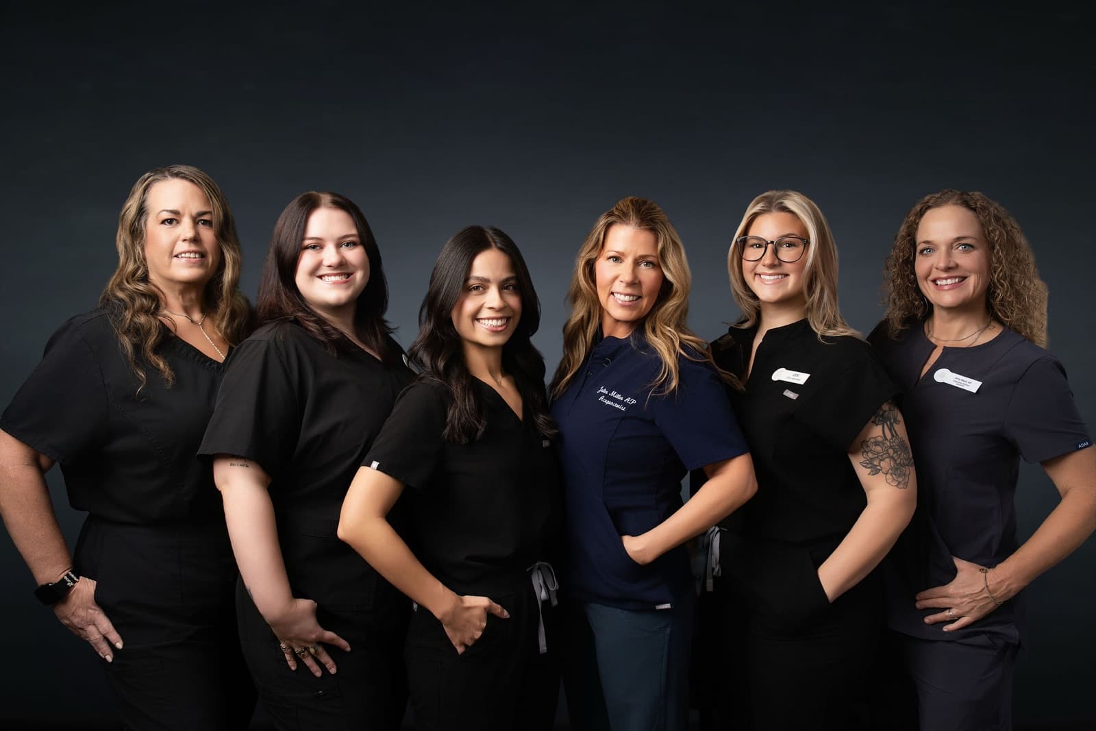 The Health Pointe Jacksonville acupuncture and wellness team in navy and black scrubs